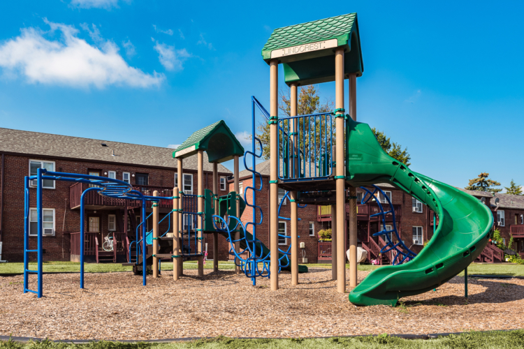 Community playground surrounded by apartment buildings