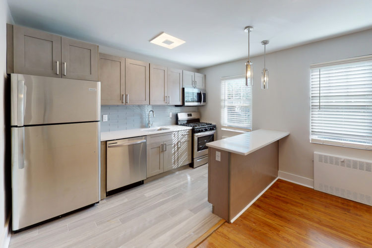 Renovated 2-bedroom apartment kitchen with stainless appliances