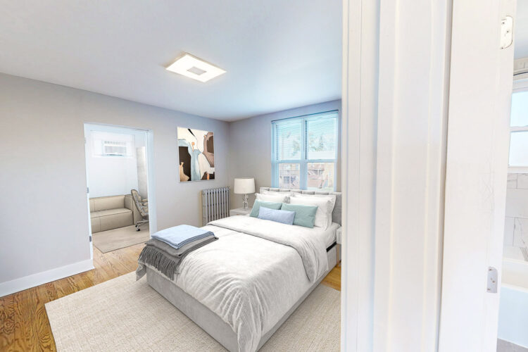 Bright, freshly finished bedroom with hardwood floors